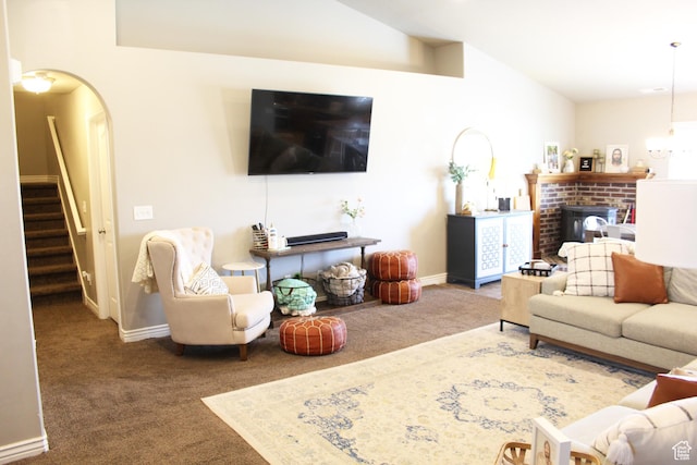515 S Stump Hollow Rd, Garden City, UT 84028 - living area featuring lofted ceiling, carpet flooring, stairs, arched walkways, and baseboards