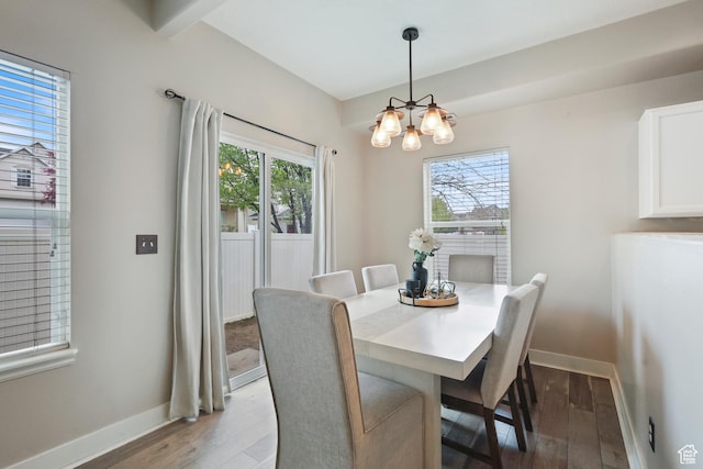 6785 W Callery Ln S, West Jordan, UT 84081 - dining room with an inviting chandelier, baseboards, and wood finished floors