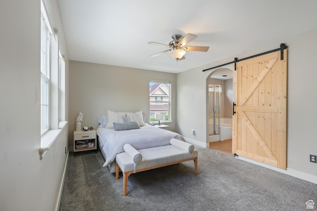 6785 W Callery Ln S, West Jordan, UT 84081 - bedroom with carpet floors, arched walkways, baseboards, and a barn door