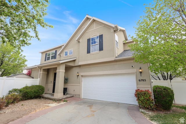 6785 W Callery Ln S, West Jordan, UT 84081 - traditional-style home featuring concrete driveway, a garage, fence, and stucco siding