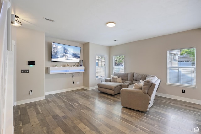 6785 W Callery Ln S, West Jordan, UT 84081 - living room featuring baseboards, hardwood / wood-style floors, and visible vents