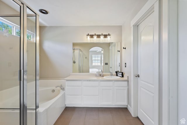 6785 W Callery Ln S, West Jordan, UT 84081 - bathroom with vanity, a bath, and a shower stall