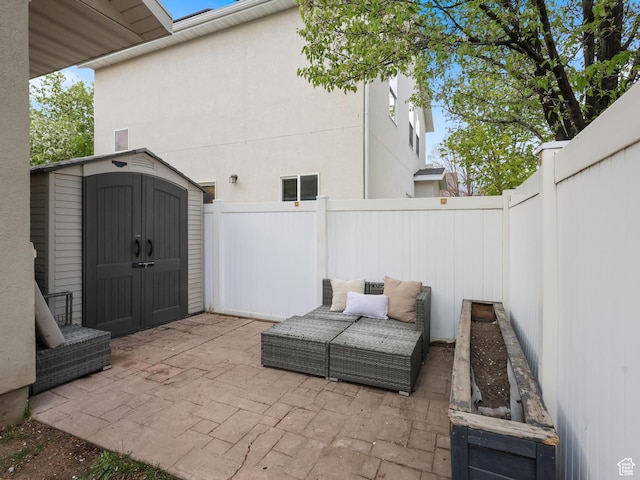6785 W Callery Ln S, West Jordan, UT 84081 - view of patio / terrace with a fenced backyard, an outdoor structure, and a shed