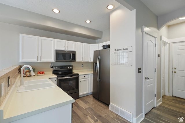 6785 W Callery Ln S, West Jordan, UT 84081 - kitchen with visible vents, a sink, white cabinetry, and stainless steel appliances