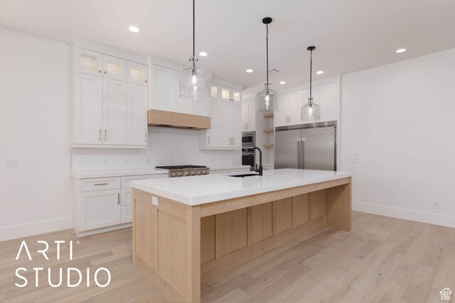 5220 W 2040 S, Hurricane, UT 84737 - kitchen featuring built in appliances, backsplash, baseboards, a sink, and recessed lighting