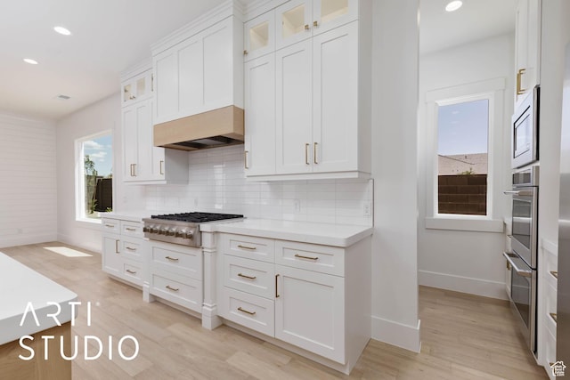5220 W 2040 S, Hurricane, UT 84737 - kitchen with stainless steel appliances, baseboards, light countertops, backsplash, and white cabinets