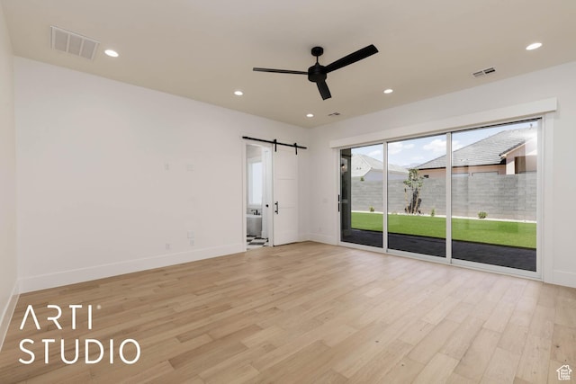 5220 W 2040 S, Hurricane, UT 84737 - unfurnished room featuring a barn door, a ceiling fan, baseboards, light wood-style floors, and recessed lighting