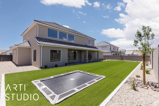 5220 W 2040 S, Hurricane, UT 84737 - rear view of house with a trampoline, stucco siding, and a patio area