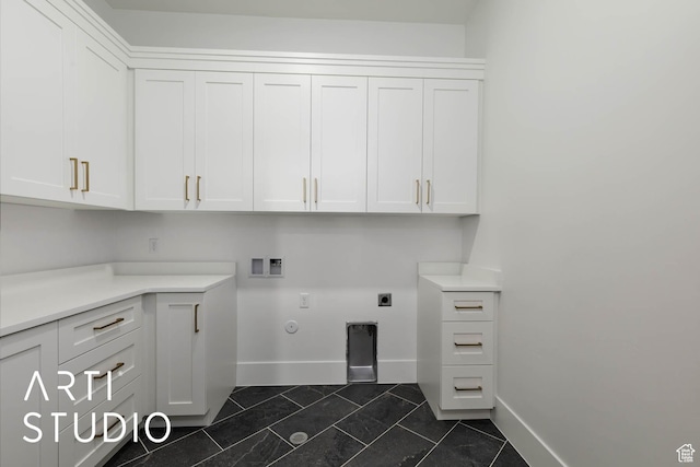 5220 W 2040 S, Hurricane, UT 84737 - laundry area featuring cabinet space, washer hookup, baseboards, hookup for an electric dryer, and hookup for a gas dryer