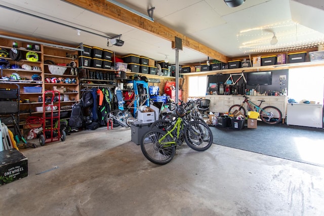465 S Main St, Providence, UT 84332 - garage featuring a garage door opener and a workshop area