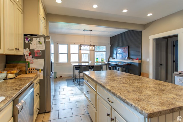465 S Main St, Providence, UT 84332 - kitchen with light tile patterned flooring, recessed lighting, a center island, hanging light fixtures, and stainless steel appliances