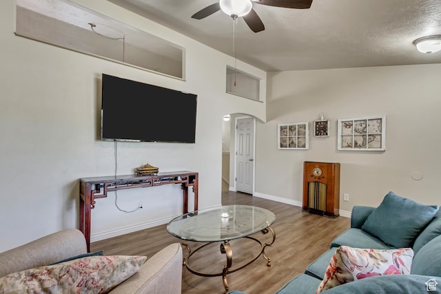 126 W Casi Way, Saratoga Springs, UT 84045 - living area with a ceiling fan, lofted ceiling, arched walkways, wood finished floors, and baseboards