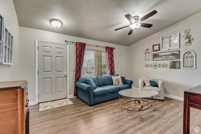 126 W Casi Way, Saratoga Springs, UT 84045 - living room featuring wood finished floors, ceiling fan, baseboards, and a textured ceiling