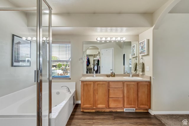 126 W Casi Way, Saratoga Springs, UT 84045 - full bathroom with a garden tub, double vanity, wood finished floors, and an enclosed shower