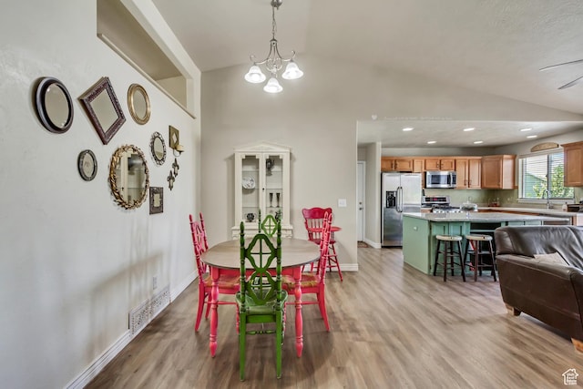126 W Casi Way, Saratoga Springs, UT 84045 - dining area with vaulted ceiling, light wood-type flooring, baseboards, a chandelier, and recessed lighting