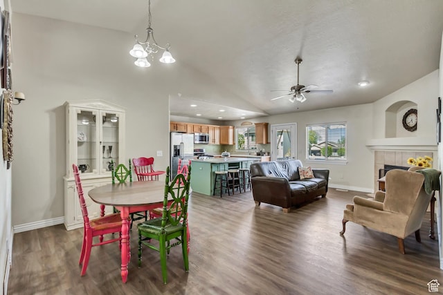 126 W Casi Way, Saratoga Springs, UT 84045 - dining area featuring baseboards, dark wood-style flooring, ceiling fan, a fireplace, and a chandelier