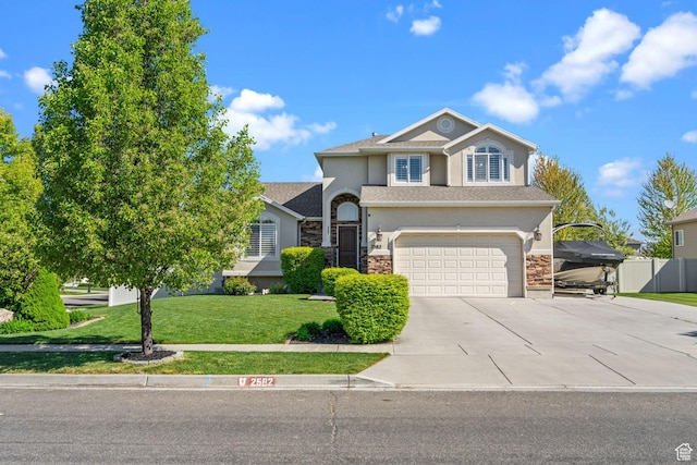 2582 W 1890 N, Clinton, UT 84015 - traditional home with an attached garage, stucco siding, concrete driveway, and a front lawn