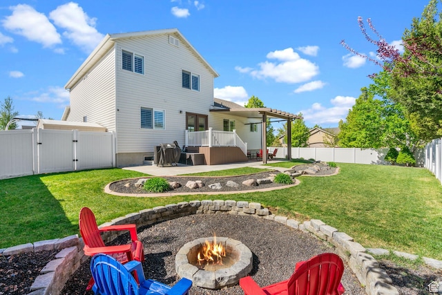 2582 W 1890 N, Clinton, UT 84015 - back of house with an outdoor fire pit, a fenced backyard, a gate, a patio area, and a lawn
