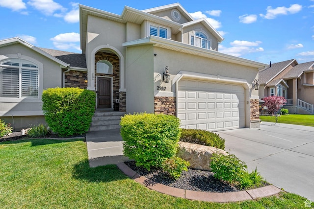 2582 W 1890 N, Clinton, UT 84015 - traditional-style house with stone siding, a garage, stucco siding, a front yard, and concrete driveway