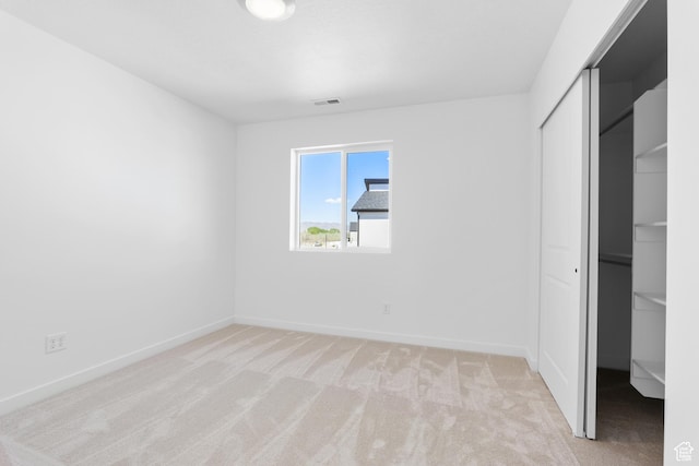 894 S 1100 W, American Fork, UT 84003 - unfurnished bedroom with a closet, visible vents, baseboards, and light carpet