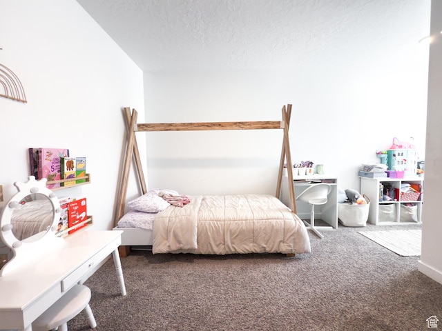 bedroom with carpet flooring and a textured ceiling