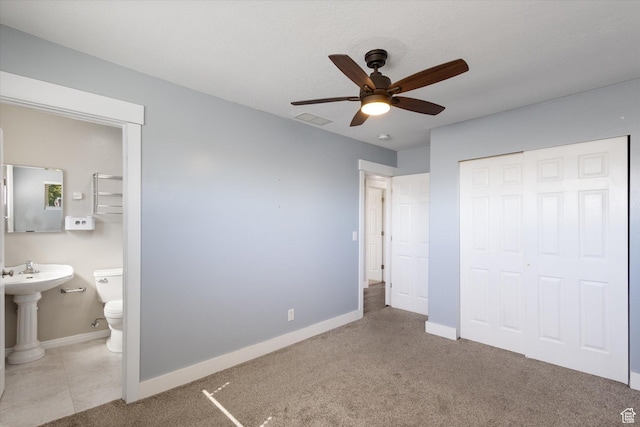 655 W 600 N, Orem, UT 84057 - unfurnished bedroom featuring a closet, baseboards, ensuite bathroom, and ceiling fan