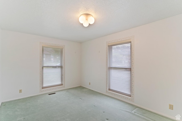 731 W 3750 N, Pleasant View, UT 84414 - spare room featuring carpet floors, a textured ceiling, visible vents, and baseboards