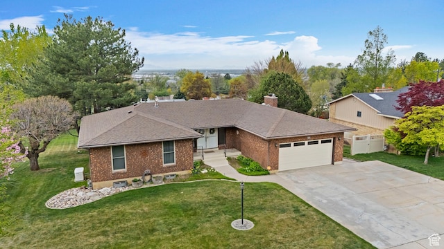 731 W 3750 N, Pleasant View, UT 84414 - ranch-style home with brick siding, an attached garage, a front yard, and concrete driveway