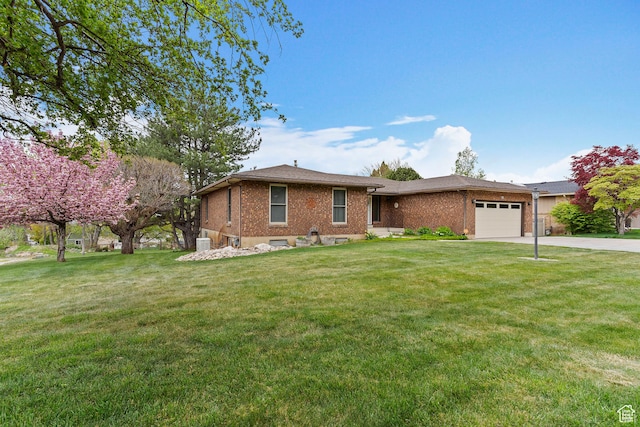 731 W 3750 N, Pleasant View, UT 84414 - ranch-style house featuring driveway, a garage, brick siding, central AC, and a front lawn