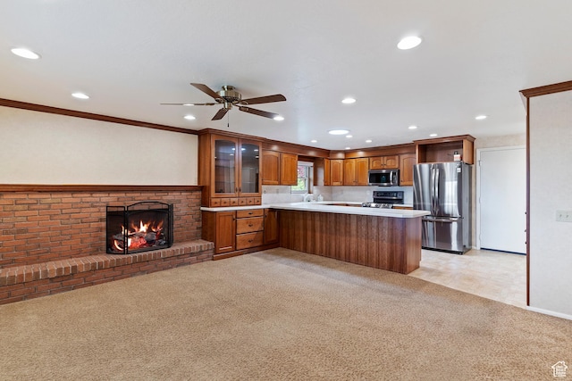 731 W 3750 N, Pleasant View, UT 84414 - kitchen with a peninsula, glass insert cabinets, recessed lighting, a ceiling fan, and appliances with stainless steel finishes
