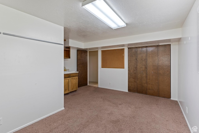 731 W 3750 N, Pleasant View, UT 84414 - finished basement featuring baseboards, light carpet, and a textured ceiling