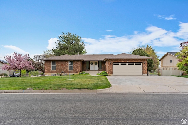 ranch-style house with brick siding, a garage, a front lawn, and driveway