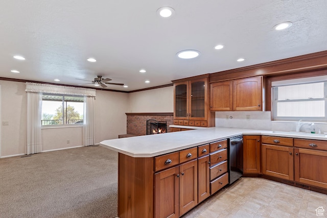 731 W 3750 N, Pleasant View, UT 84414 - kitchen featuring a peninsula, brown cabinetry, and dishwasher