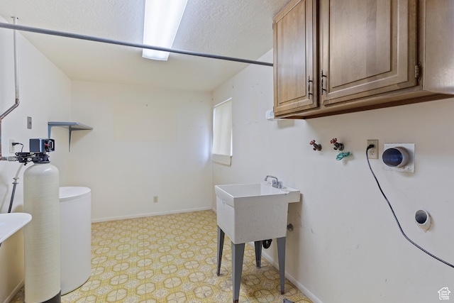 731 W 3750 N, Pleasant View, UT 84414 - clothes washing area featuring light floors, baseboards, hookup for a washing machine, and cabinet space