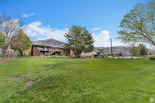731 W 3750 N, Pleasant View, UT 84414 - view of yard with fence, a mountain view, and stairs