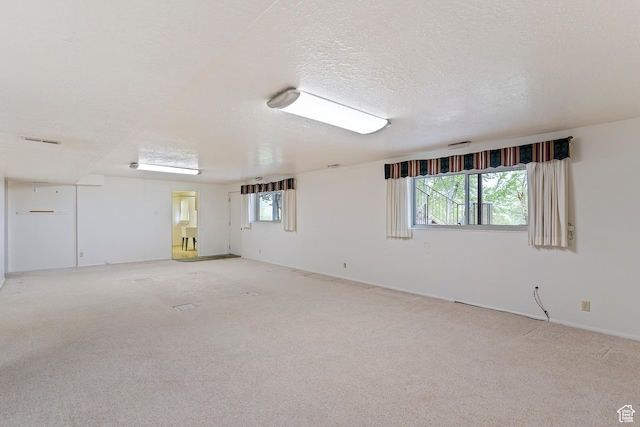731 W 3750 N, Pleasant View, UT 84414 - unfurnished room with a healthy amount of sunlight, baseboards, light carpet, and visible vents