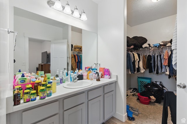 3647 W 1530 N Unit Hh204, Lehi, UT 84043 - bathroom featuring vanity and a walk in closet