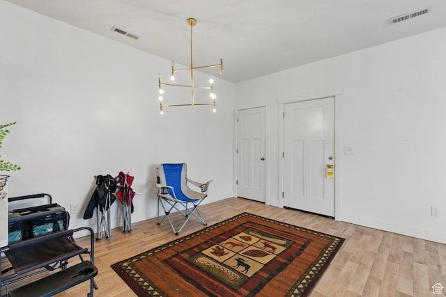 3647 W 1530 N Unit Hh204, Lehi, UT 84043 - foyer entrance with visible vents, wood finished floors, and a notable chandelier
