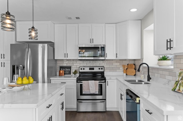 3559 W Lexington View Dr, West Jordan, UT 84088 - kitchen with a sink, light stone countertops, stainless steel appliances, and visible vents