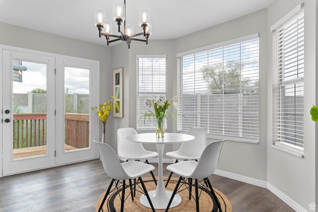 3559 W Lexington View Dr, West Jordan, UT 84088 - dining area featuring baseboards, dark wood-style flooring, and a chandelier