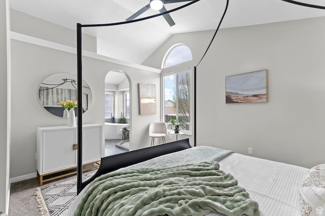 3559 W Lexington View Dr, West Jordan, UT 84088 - bedroom with arched walkways, a ceiling fan, vaulted ceiling, and carpet flooring