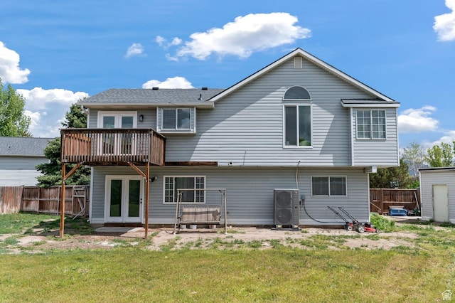 3559 W Lexington View Dr, West Jordan, UT 84088 - rear view of property featuring a lawn, fence, and french doors