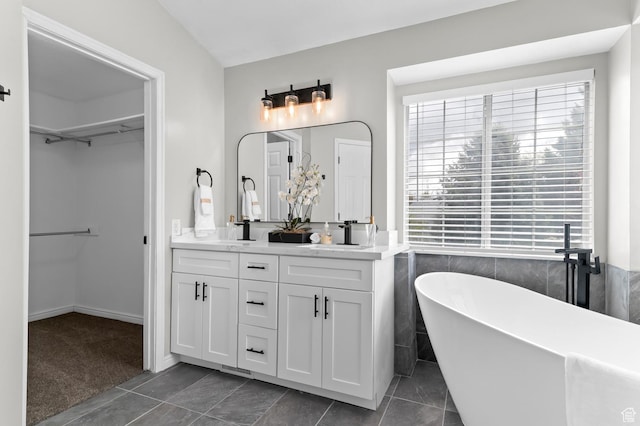 3559 W Lexington View Dr, West Jordan, UT 84088 - full bath featuring double vanity, plenty of natural light, a soaking tub, and a spacious closet
