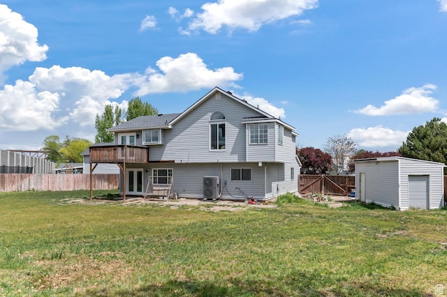 3559 W Lexington View Dr, West Jordan, UT 84088 - back of house with fence, a wooden deck, a patio, french doors, and a lawn