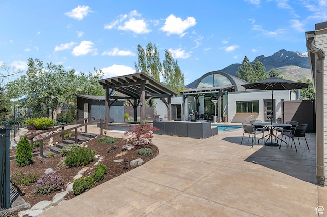 view of patio / terrace featuring outdoor dining area, an outdoor pool, a gazebo, fence, and outdoor lounge area