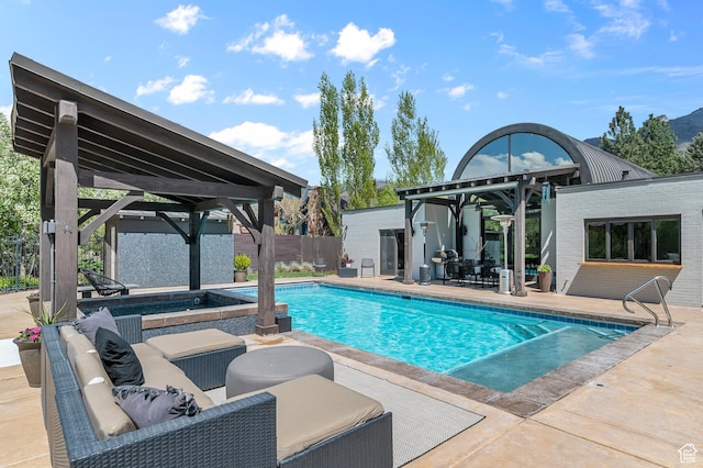 pool with a gazebo, outdoor lounge area, a patio area, and fence
