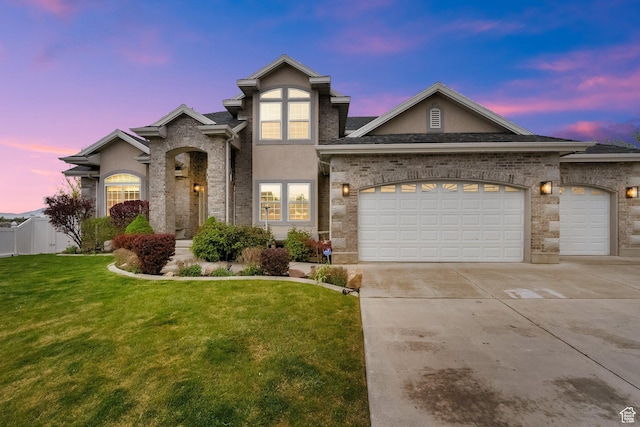 2693 W 2400 N, Lehi, UT 84043 - view of front of property featuring an attached garage, stucco siding, driveway, and a front lawn