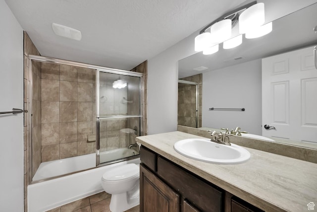 2693 W 2400 N, Lehi, UT 84043 - bathroom featuring vanity, tile patterned flooring, enclosed tub / shower combo, and toilet