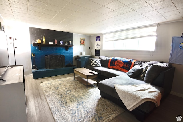 3223 S Fairlane St, Magna, UT 84044 - living area featuring wood finished floors and a fireplace