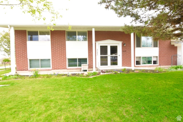 3223 S Fairlane St, Magna, UT 84044 - back of property with brick siding and a yard